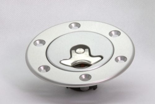 Bolt On Fuel Cap with Neck displayed on a neutral background. The cap is circular, silver-colored, with a central locking mechanism and six evenly spaced holes around the edge for secure attachment.